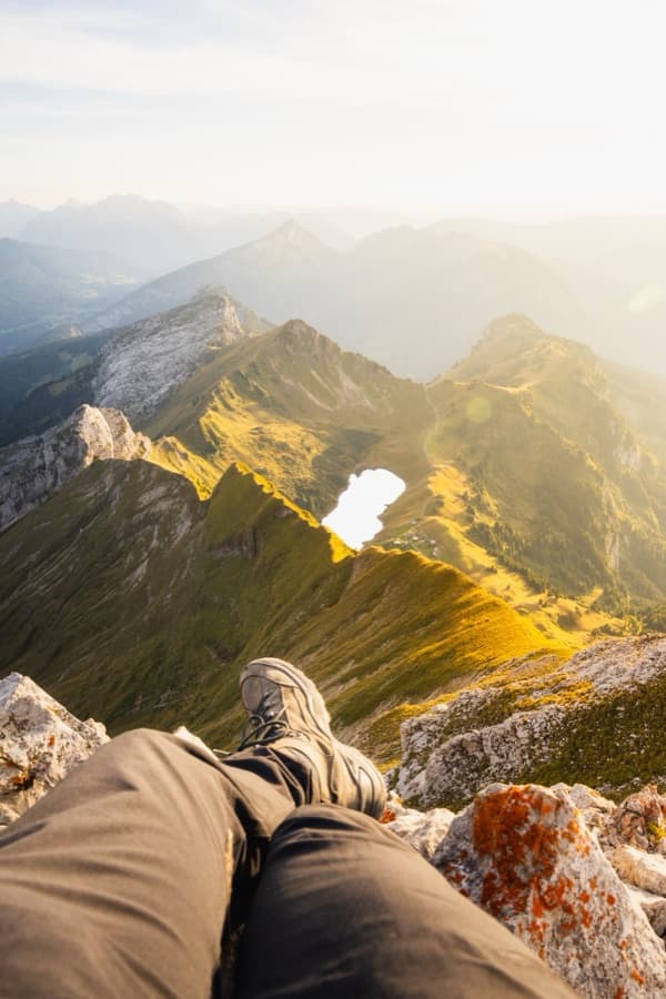 Resting on the summit of Pic de Jallouvre with Lac de Peyre far below