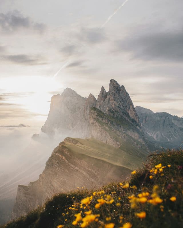 The jagged Seceda ridge rising out of morning cloud