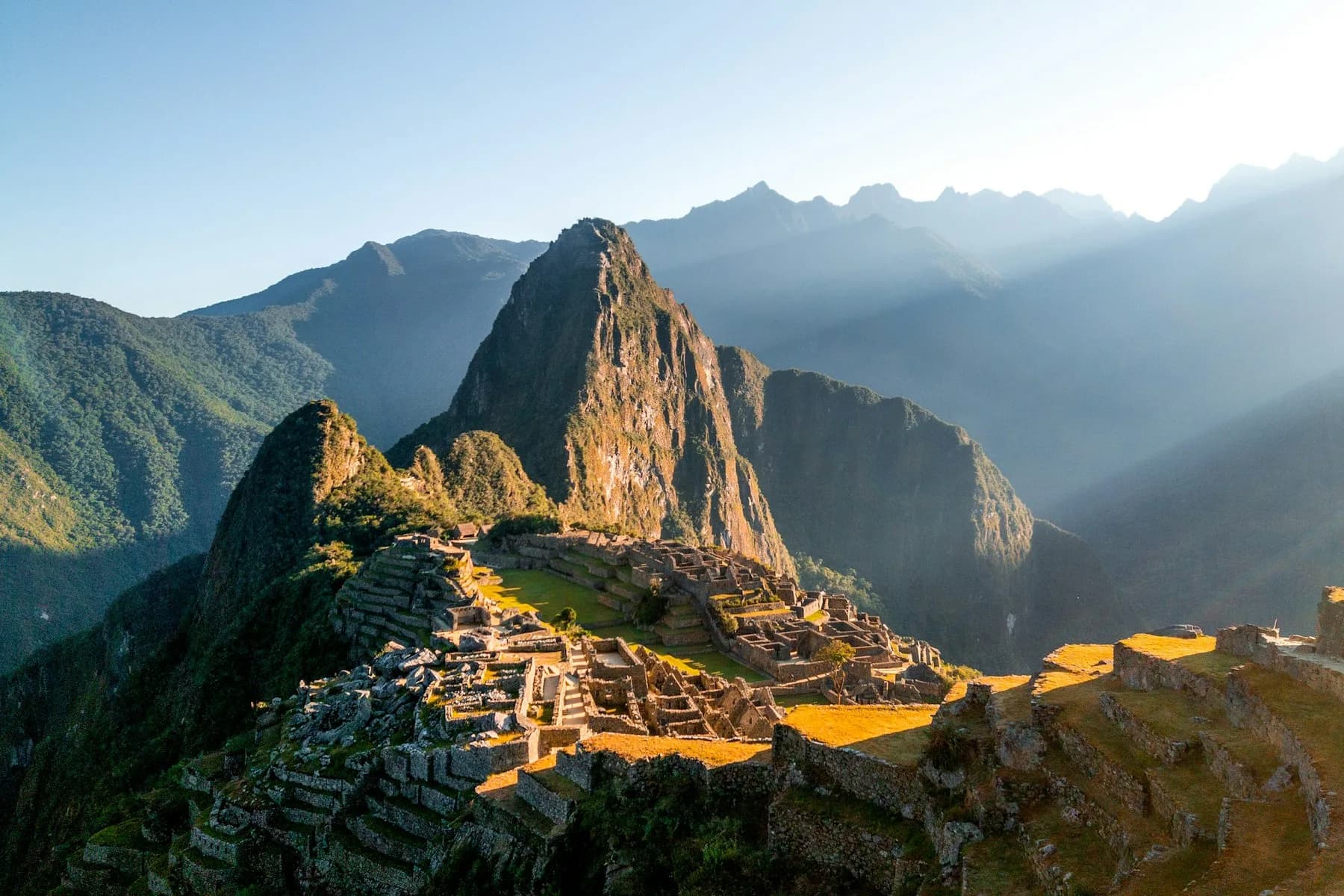 Machu Picchu and Huayna Picchu in low morning light above the Urubamba valley